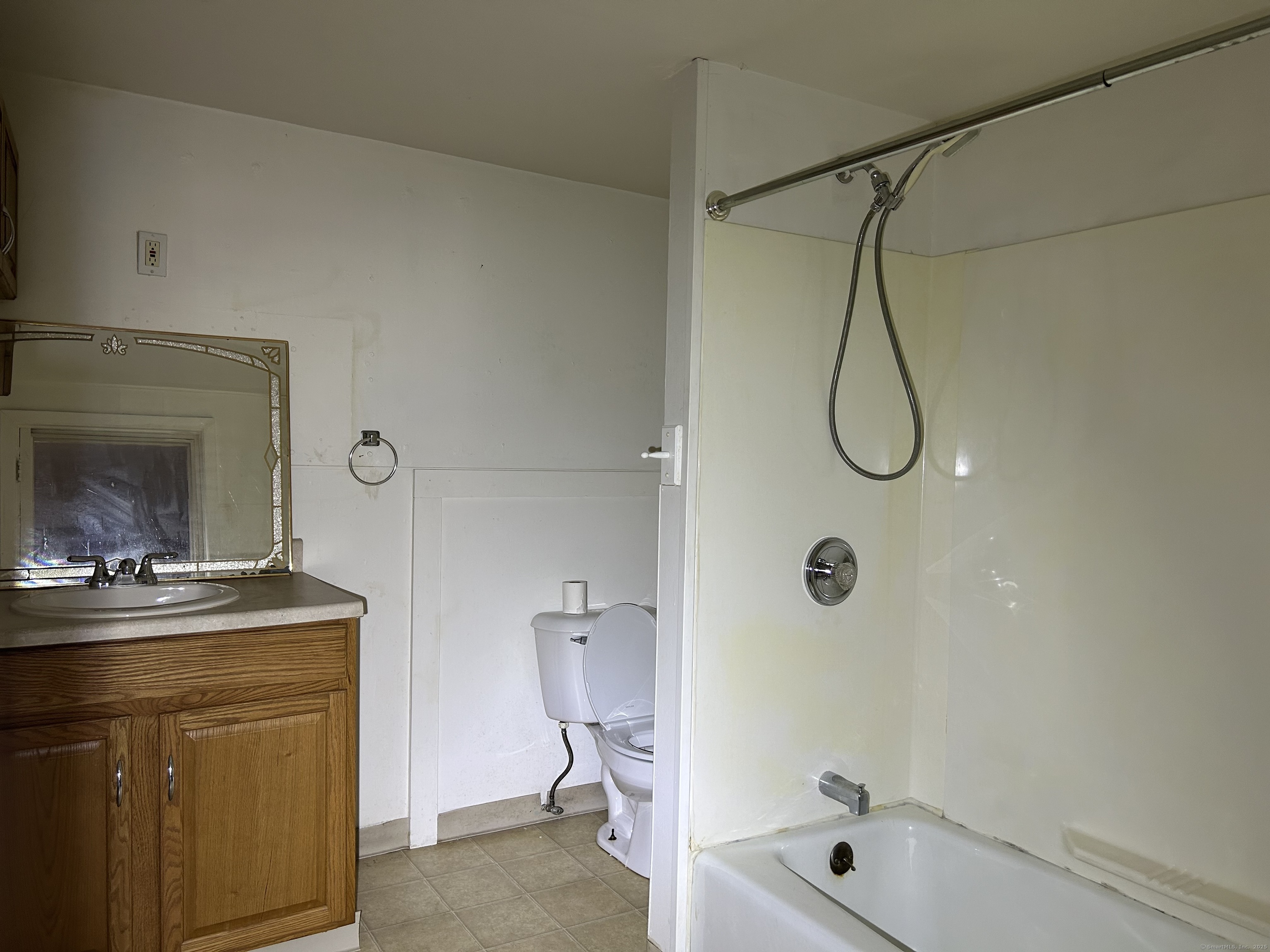 47 Gilbert Street, Unit 1 Derby, CT 06418 - Photo 11 of 21 a bathroom with a granite countertop sink a toilet and shower