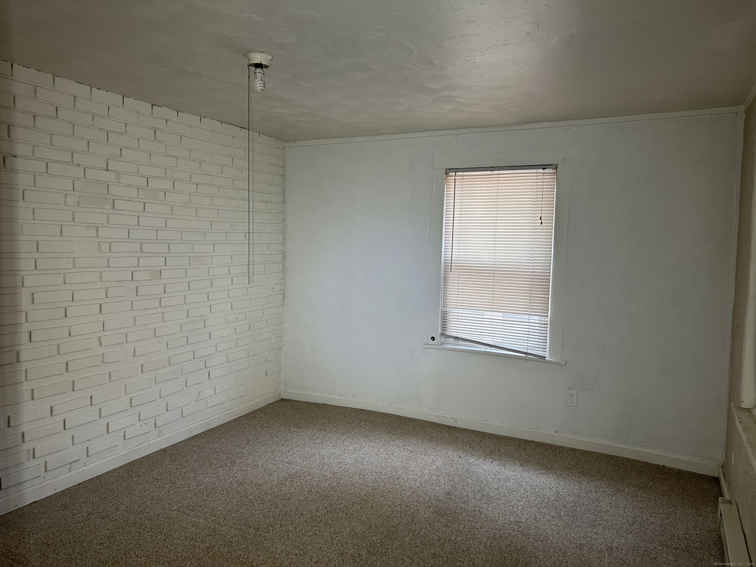 47 Gilbert Street, Unit 1 Derby, CT 06418 - Photo 13 of 21 an empty room with a window