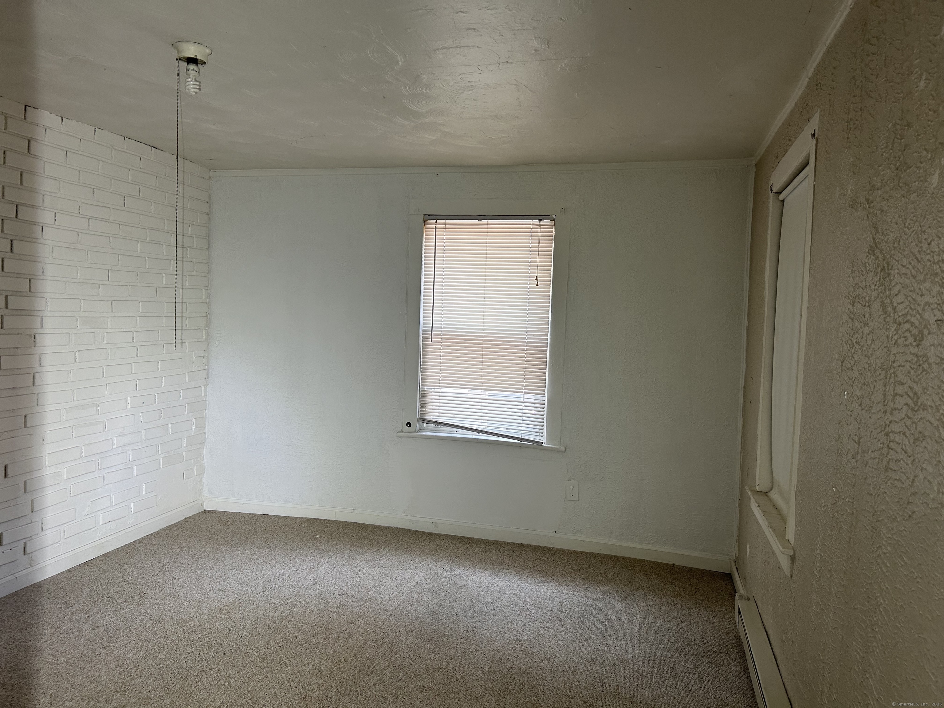47 Gilbert Street, Unit 1 Derby, CT 06418 - Photo 14 of 21 an empty room with a window