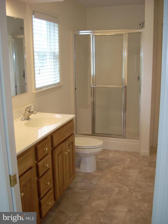 548 Wallingford Road Lancaster, PA 17601 - Photo 12 of 12 a bathroom with a sink a toilet and shower