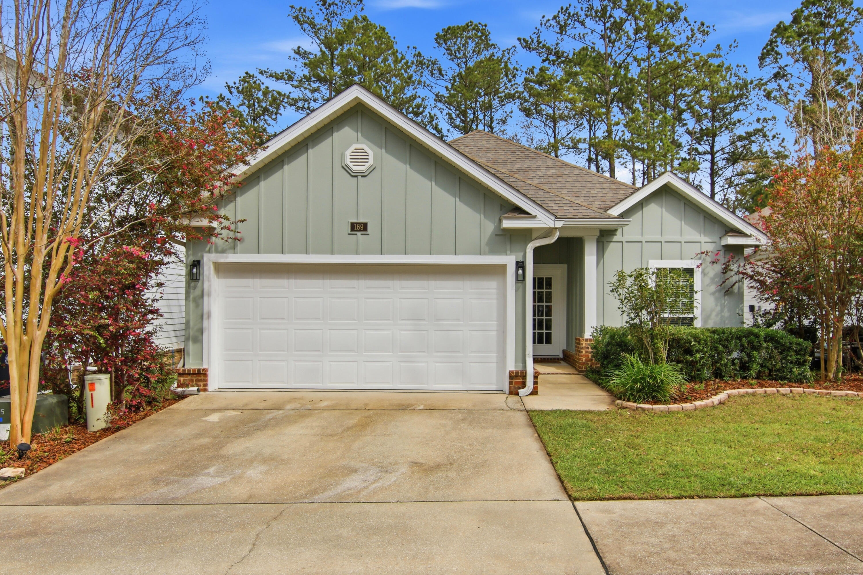 169 Marsh Landing North Freeport, FL 32439 - Photo 1 of 44 a view of house with a yard and potted plants