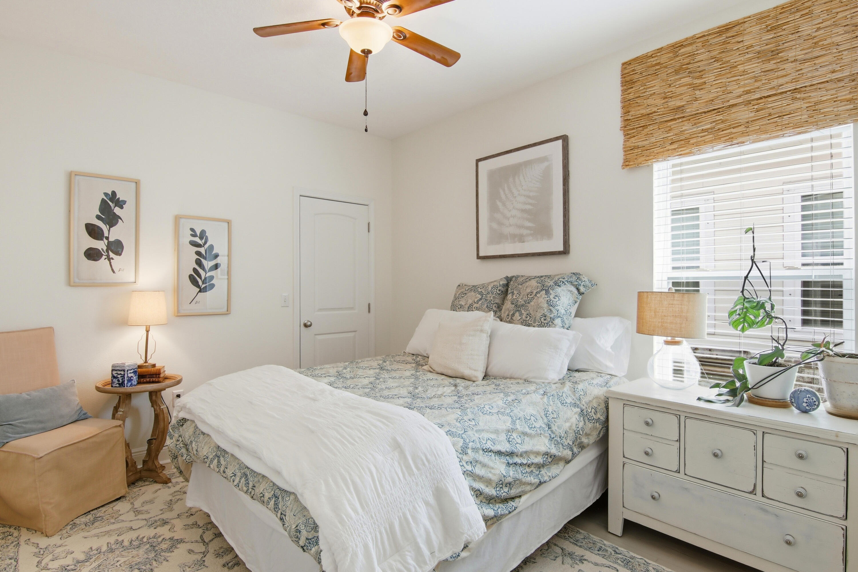 169 Marsh Landing North Freeport, FL 32439 - Photo 22 of 44 a bedroom with a large bed and a chandelier