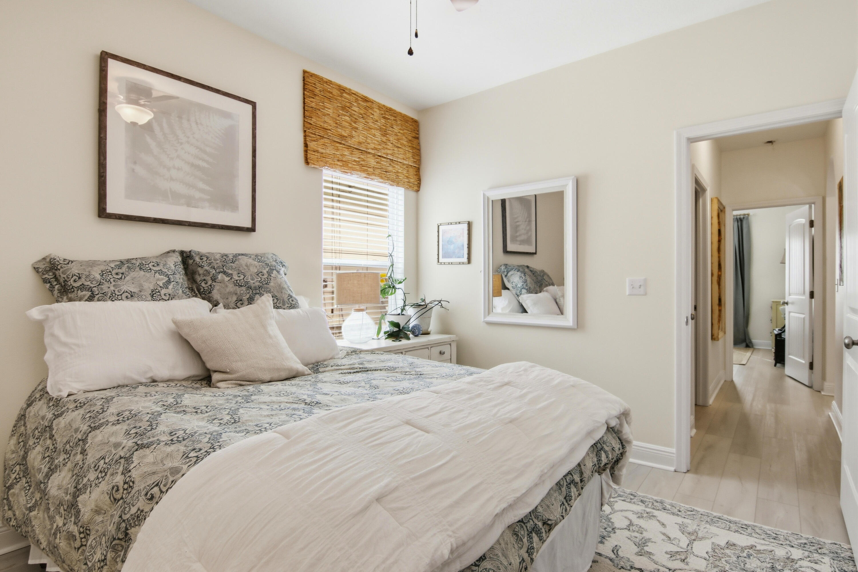 169 Marsh Landing North Freeport, FL 32439 - Photo 23 of 44 a bedroom with a bed and a painting on the wall