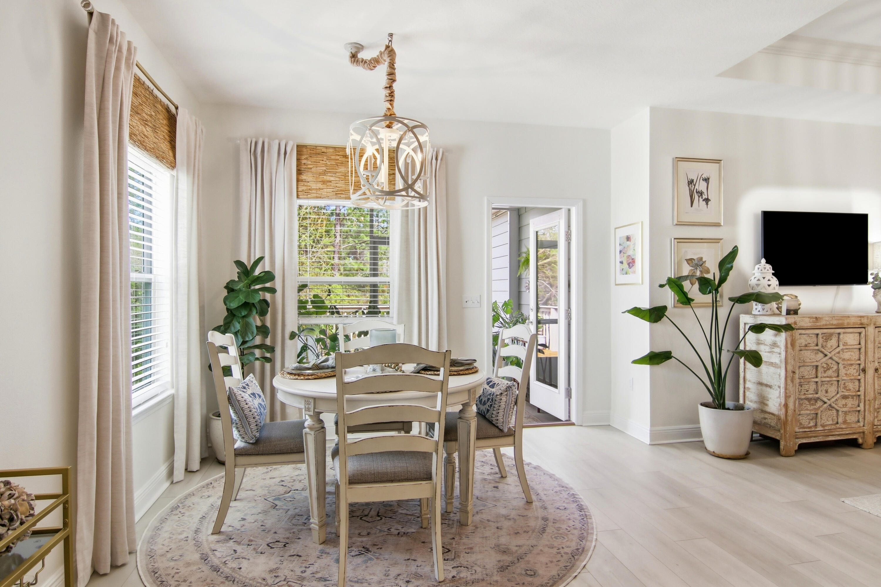 169 Marsh Landing North Freeport, FL 32439 - Photo 25 of 44 a dining room with furniture potted plants and wooden floor