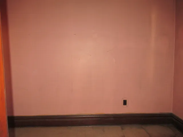 a view of a hallway with a window