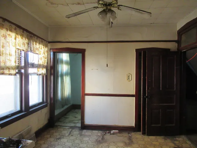 a kitchen with stainless steel appliances granite countertop a refrigerator and a stove