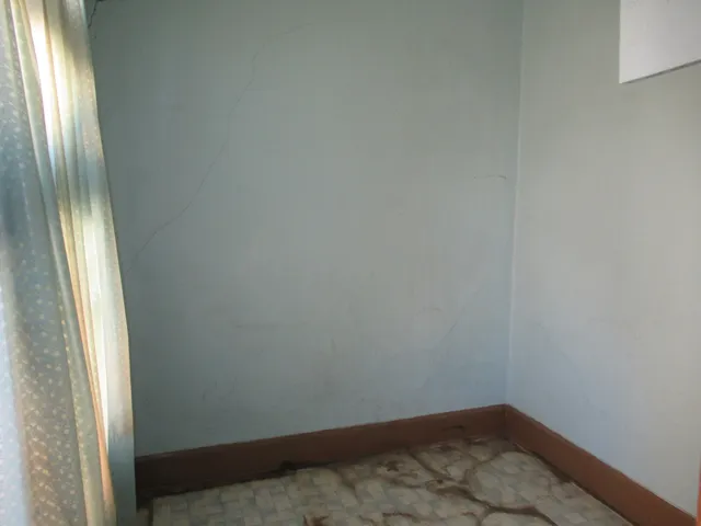 a kitchen with a refrigerator stove and cabinets