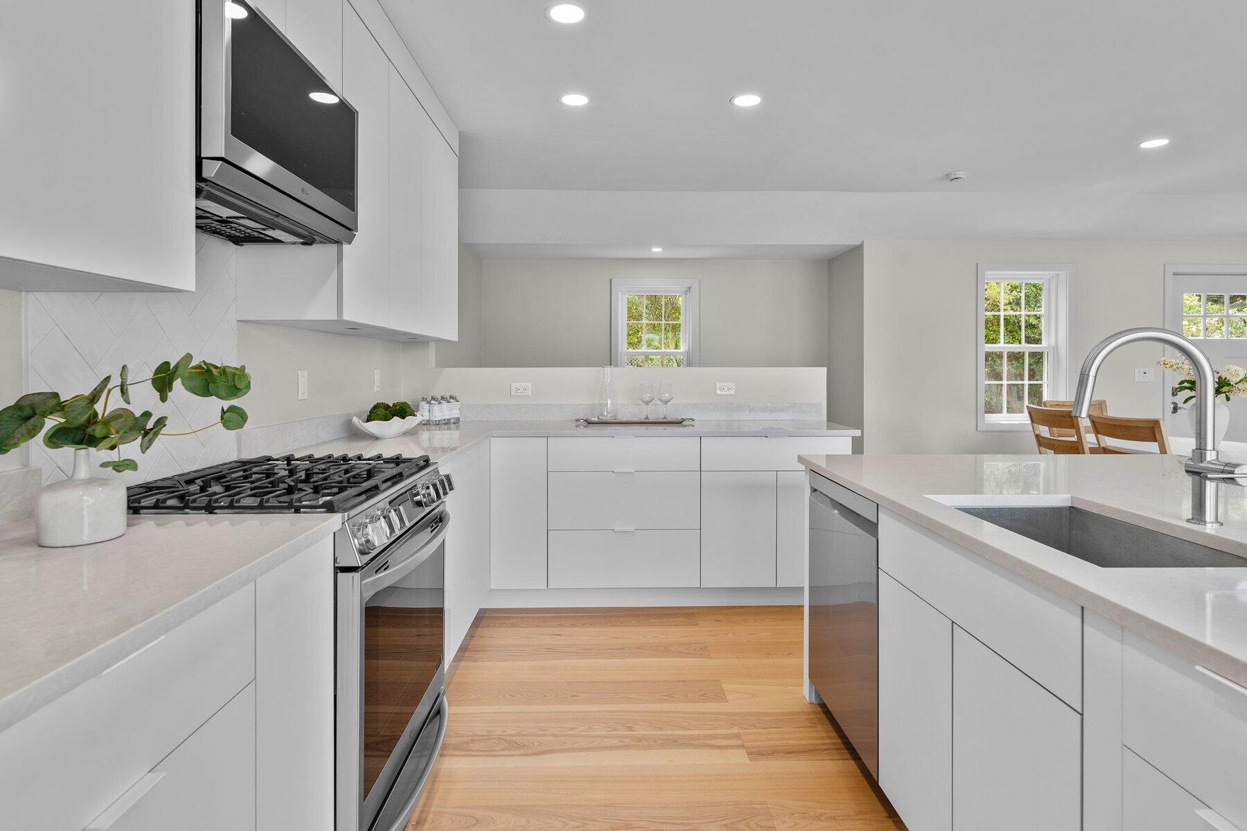 162 Main Street Osterville, MA 02655 - Photo 19 of 50 a kitchen with a sink stove and refrigerator