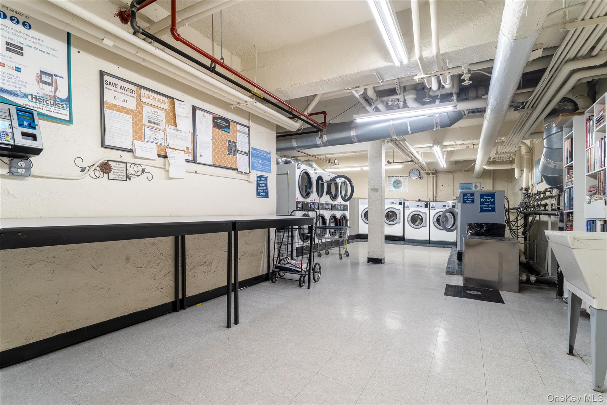 100-11 67th Road, Unit 205 Forest Hills, NY 11375 - Photo 11 of 15 a room with gym equipment