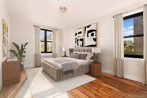 an empty room with window and wooden floor