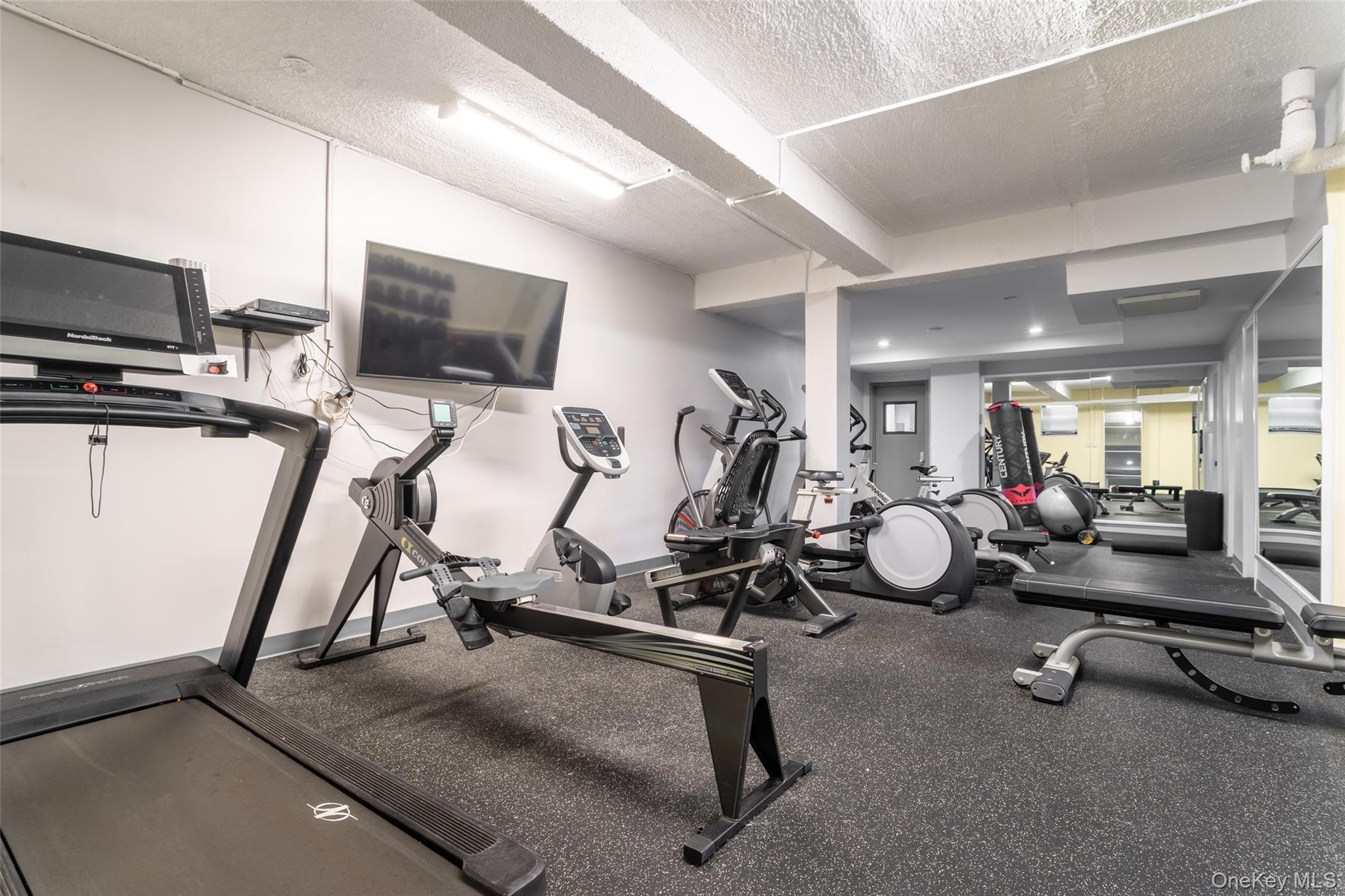 100-11 67th Road, Unit 205 Forest Hills, NY 11375 - Photo 10 of 15 a view of a room with gym equipment