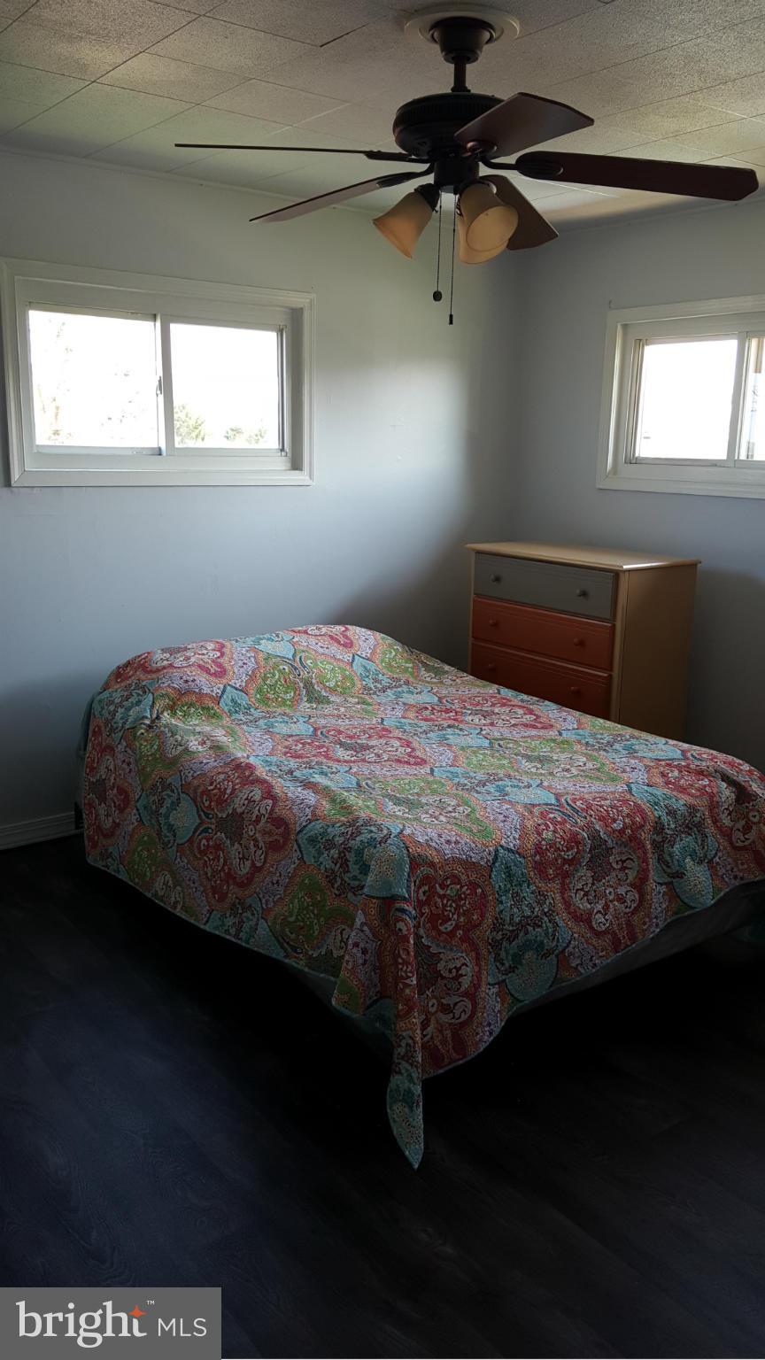 1008 Collwood Road Catonsville, MD 21228 - Photo 11 of 25 a bedroom with a bed next to a window