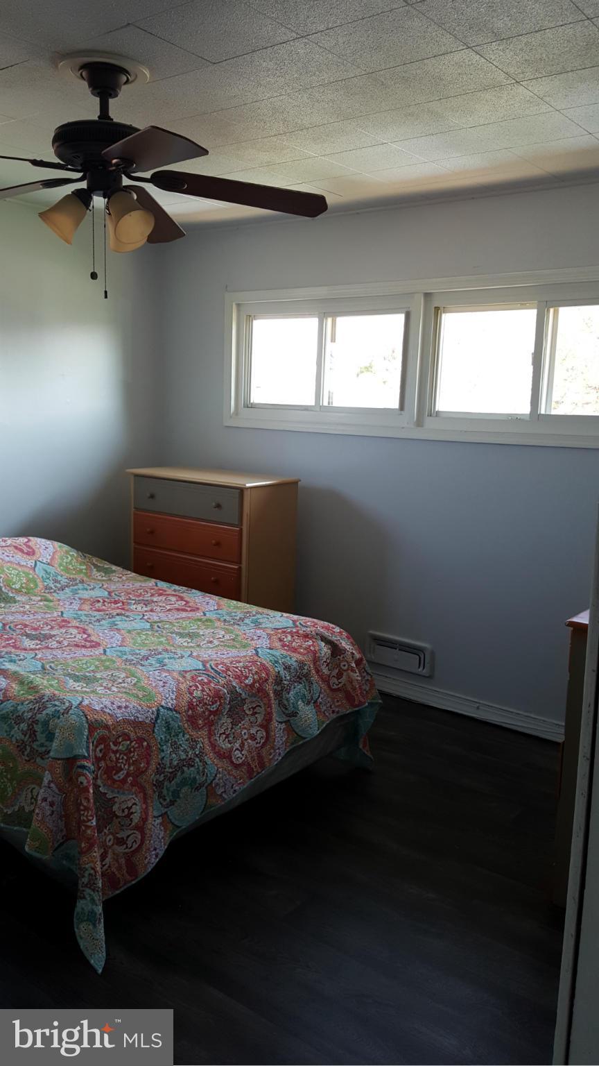 1008 Collwood Road Catonsville, MD 21228 - Photo 12 of 25 a bedroom with a bed and a window