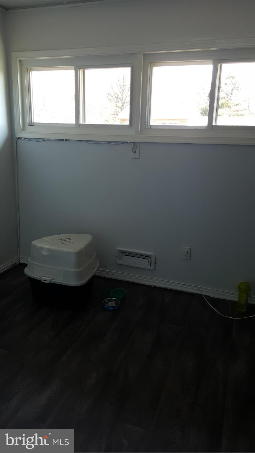 1008 Collwood Road Catonsville, MD 21228 - Photo 15 of 25 a view of a livingroom with an empty space and window