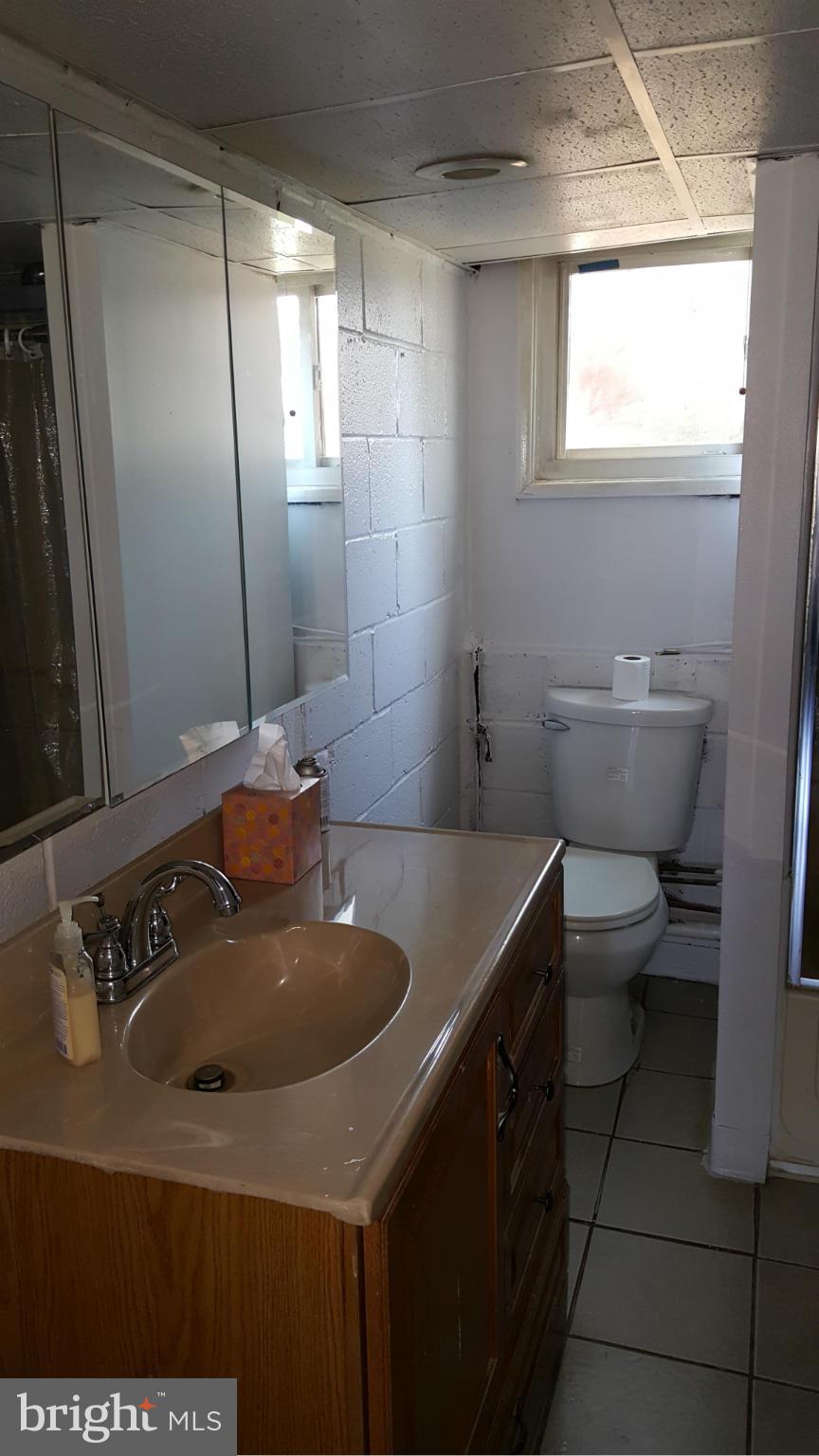 1008 Collwood Road Catonsville, MD 21228 - Photo 20 of 25 a bathroom with a sink and a toilet