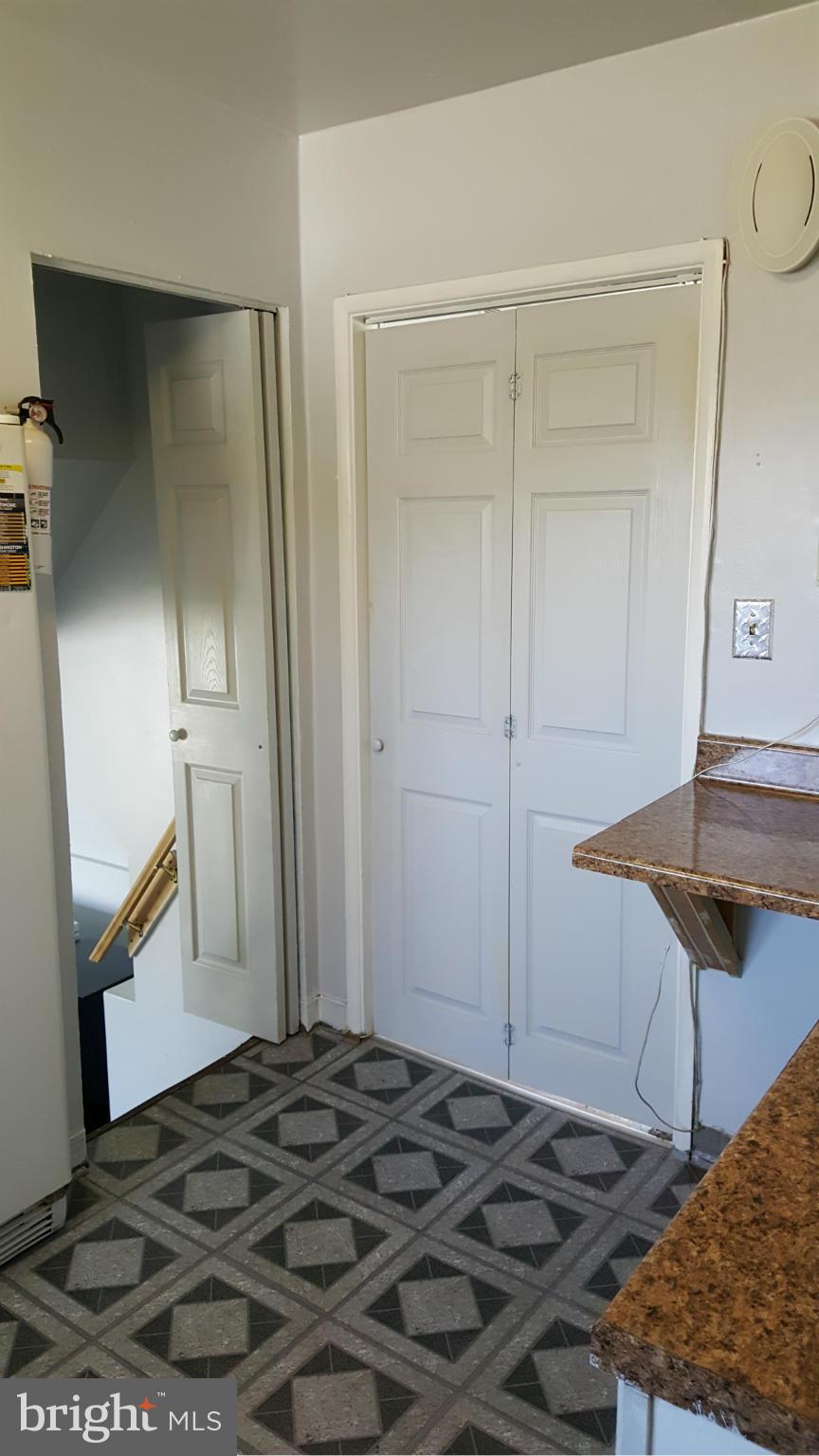 1008 Collwood Road Catonsville, MD 21228 - Photo 3 of 25 a bedroom with a bed and a stove