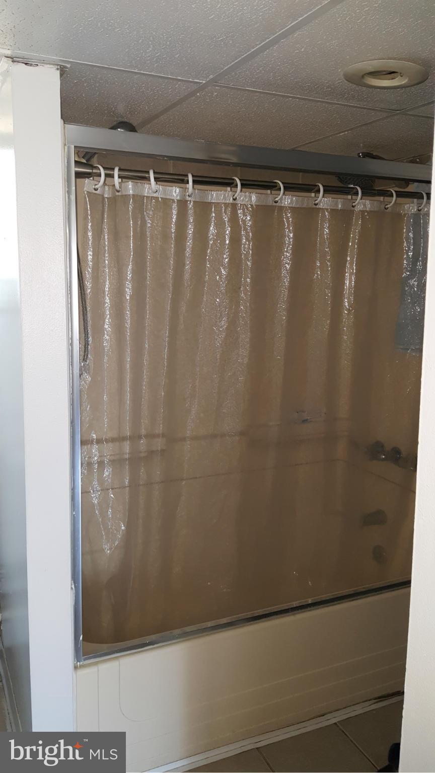 1008 Collwood Road Catonsville, MD 21228 - Photo 21 of 25 a bathroom with a shower and a shower curtain