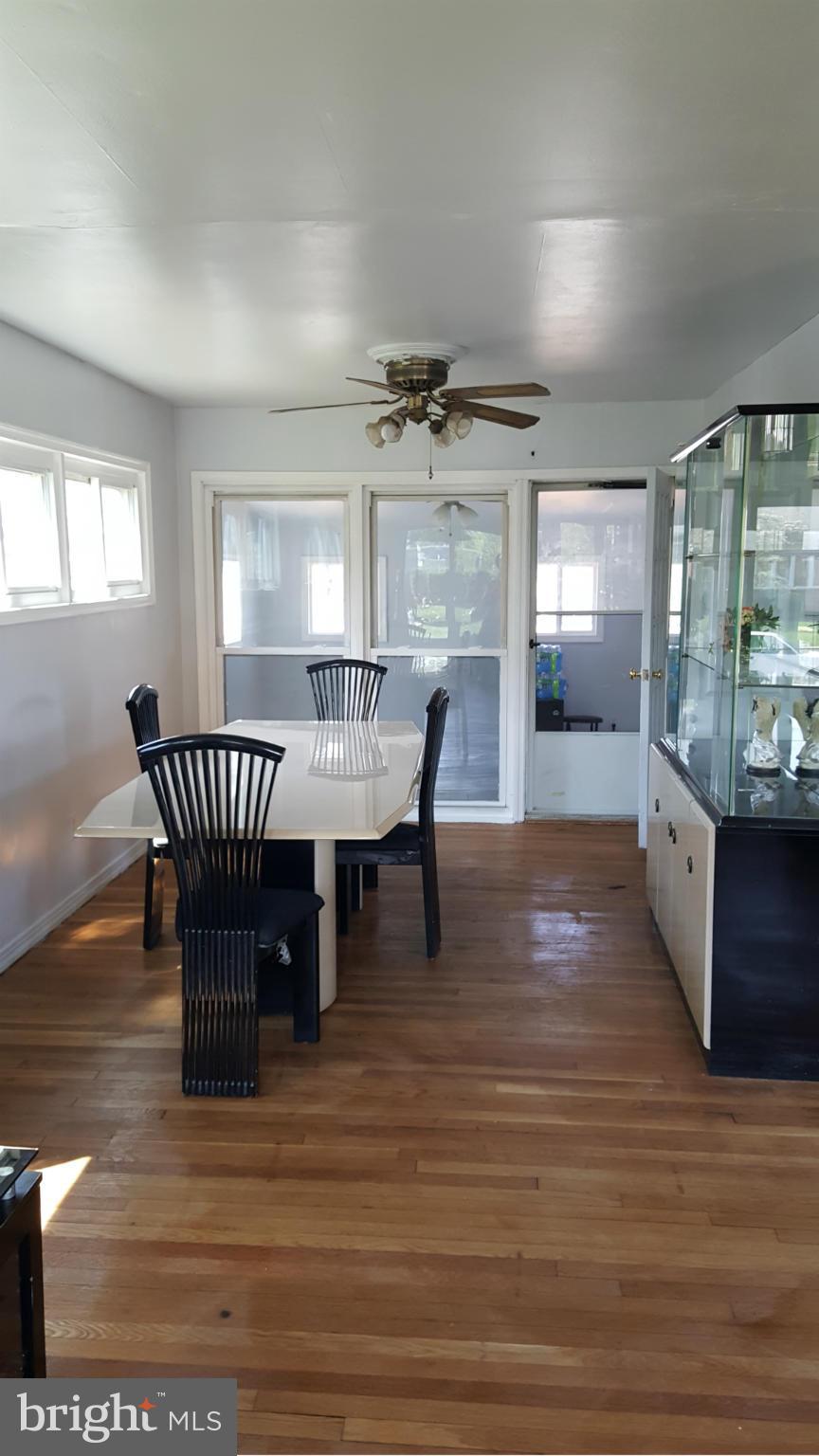 1008 Collwood Road Catonsville, MD 21228 - Photo 9 of 25 a view of a dining room with furniture window and wooden floor
