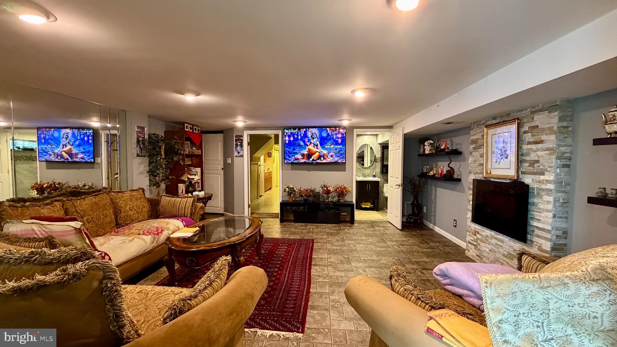 1829 Tomlinson Road Philadelphia, PA 19116 - Photo 7 of 15 a living room with furniture kitchen view and a flat screen tv