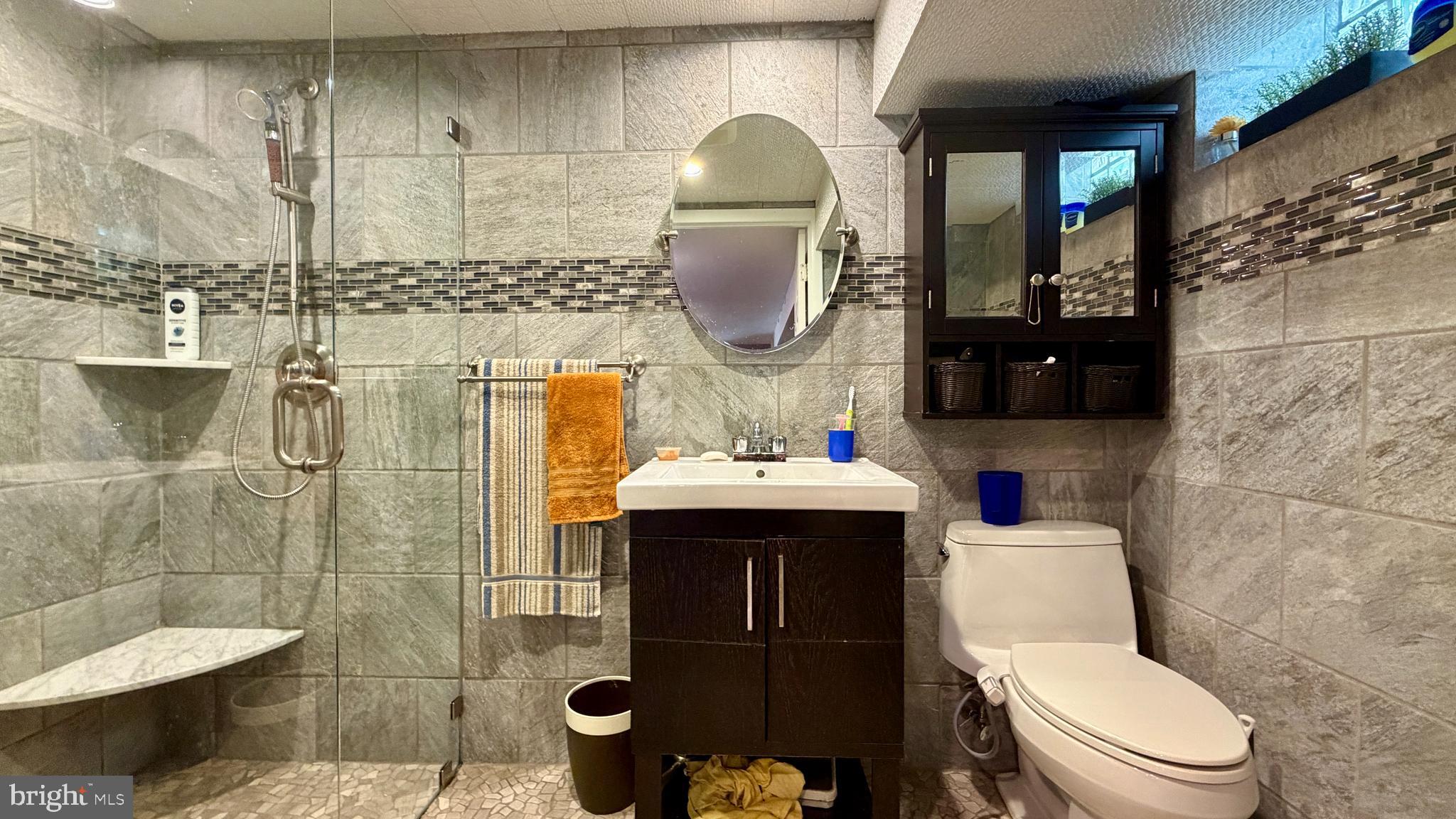 1829 Tomlinson Road Philadelphia, PA 19116 - Photo 8 of 15 a bathroom with a sink toilet and shower