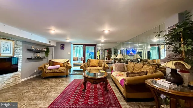 a living room with furniture and a rug