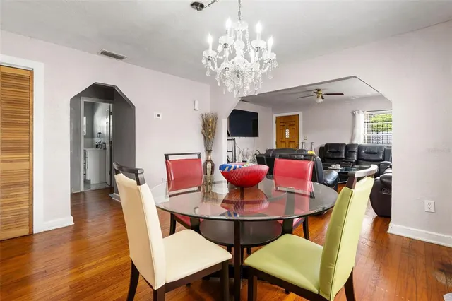 a view of a dining room with furniture and wooden floor