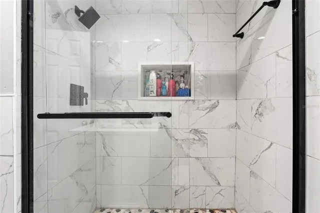 a bathroom with a bathtub and a shower