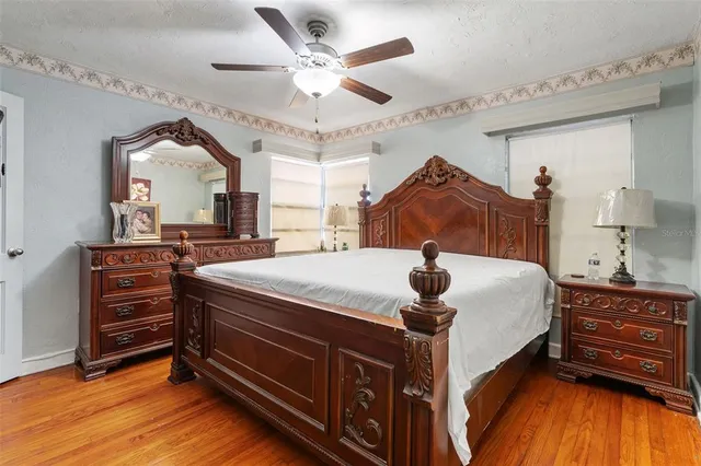 a bed room with a bed and a dresser