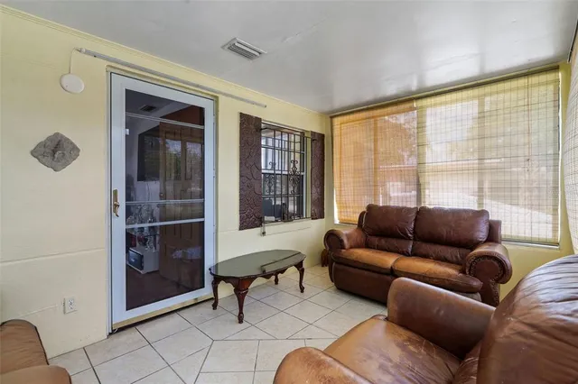 a living room with furniture and a window