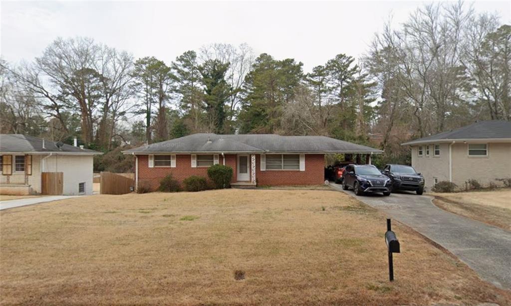2173 Kilarney Road Decatur, GA 30032 - Photo 1 of 1 a front view of a house with a yard