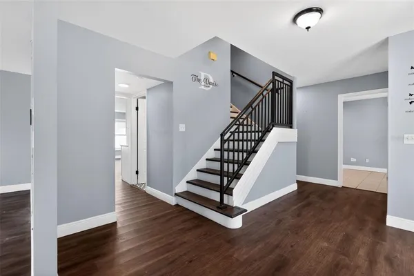 a kitchen with stainless steel appliances a refrigerator sink and microwave