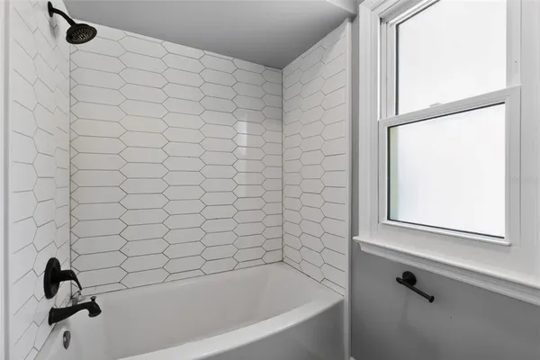 a bathroom with a granite countertop sink a toilet and a mirror