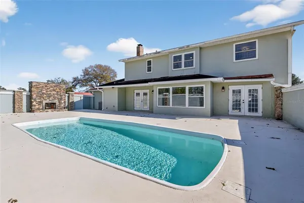 a house view with a backyard space