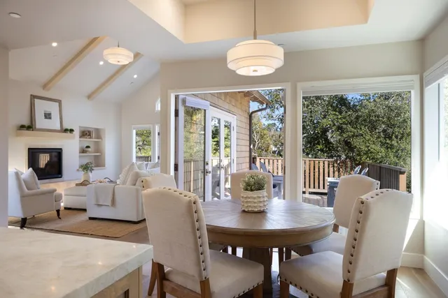 a view of a dining room with furniture wooden floor and chandelier
