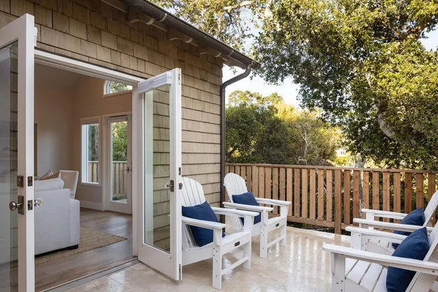 a view of a patio with chairs