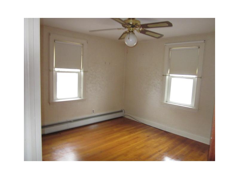 14 Hand Street Pawtucket, RI 02861 - Photo 10 of 19 Master Bedroom. Master bed on first floor with hardwood floors