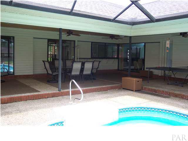 1445 Kings Road Cantonment, FL 32533 - Photo 6 of 12 Access to the pool and lanai from all areas of the house