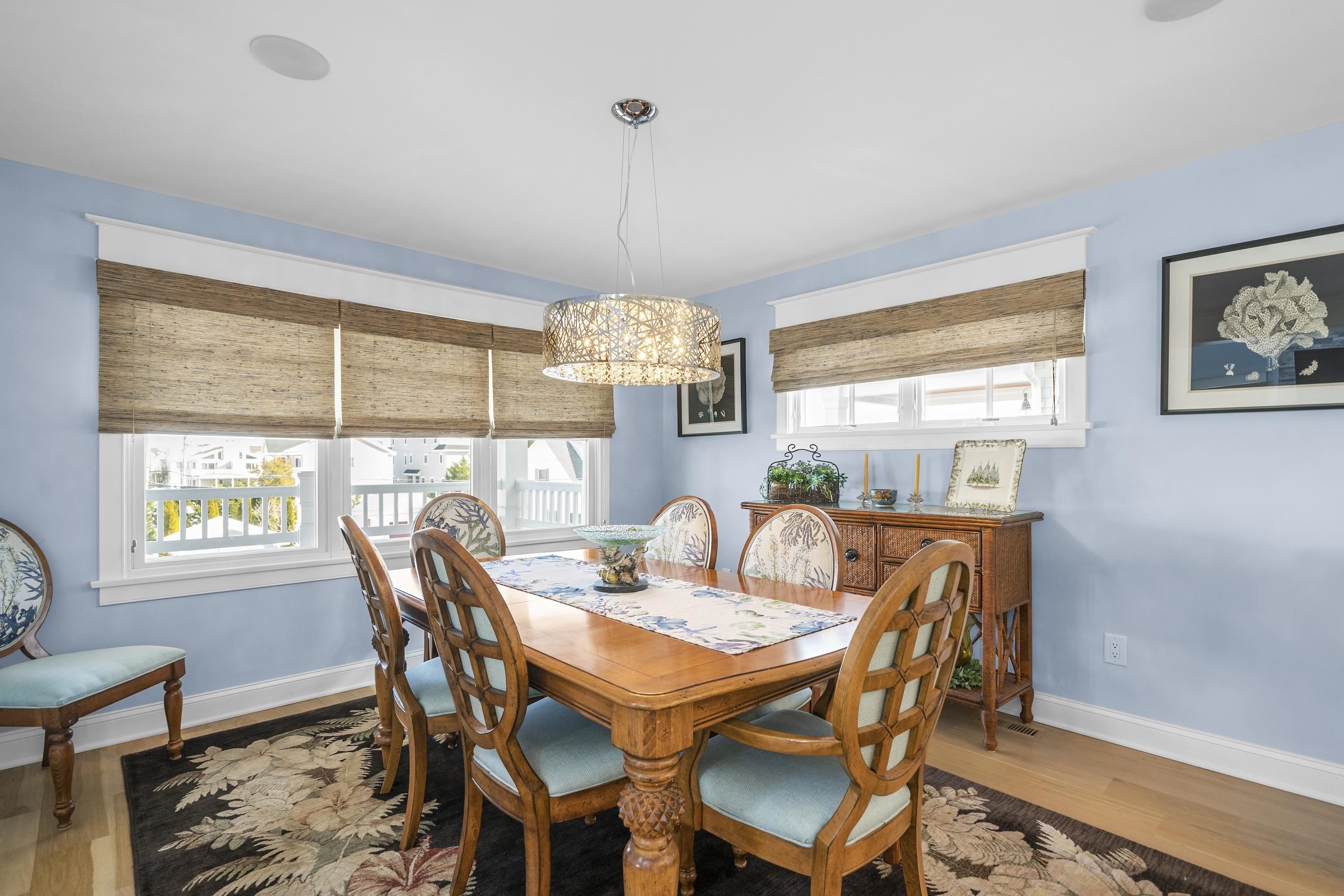 280 36th Avalon, NJ 08202 - Photo 11 of 46 a dining room with furniture a chandelier and wooden floor