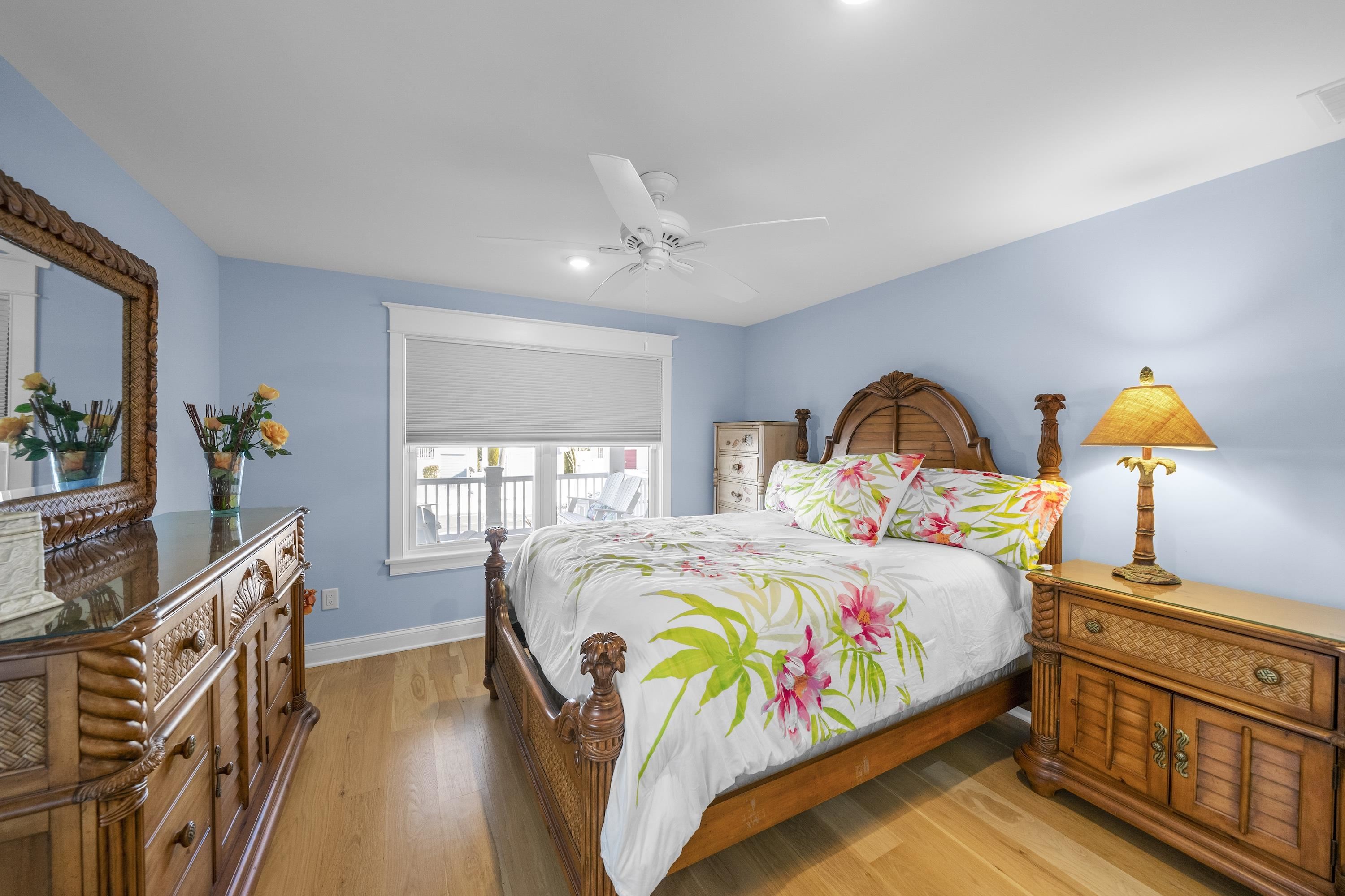 280 36th Avalon, NJ 08202 - Photo 19 of 46 a bedroom with a bed a dresser and potted plants