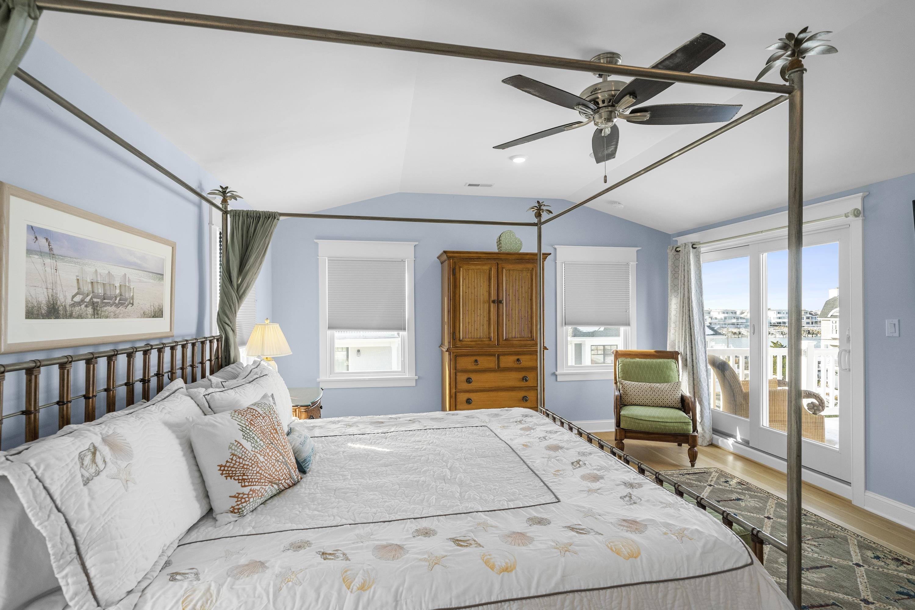 280 36th Avalon, NJ 08202 - Photo 28 of 46 a bedroom with a large bed and a chandelier