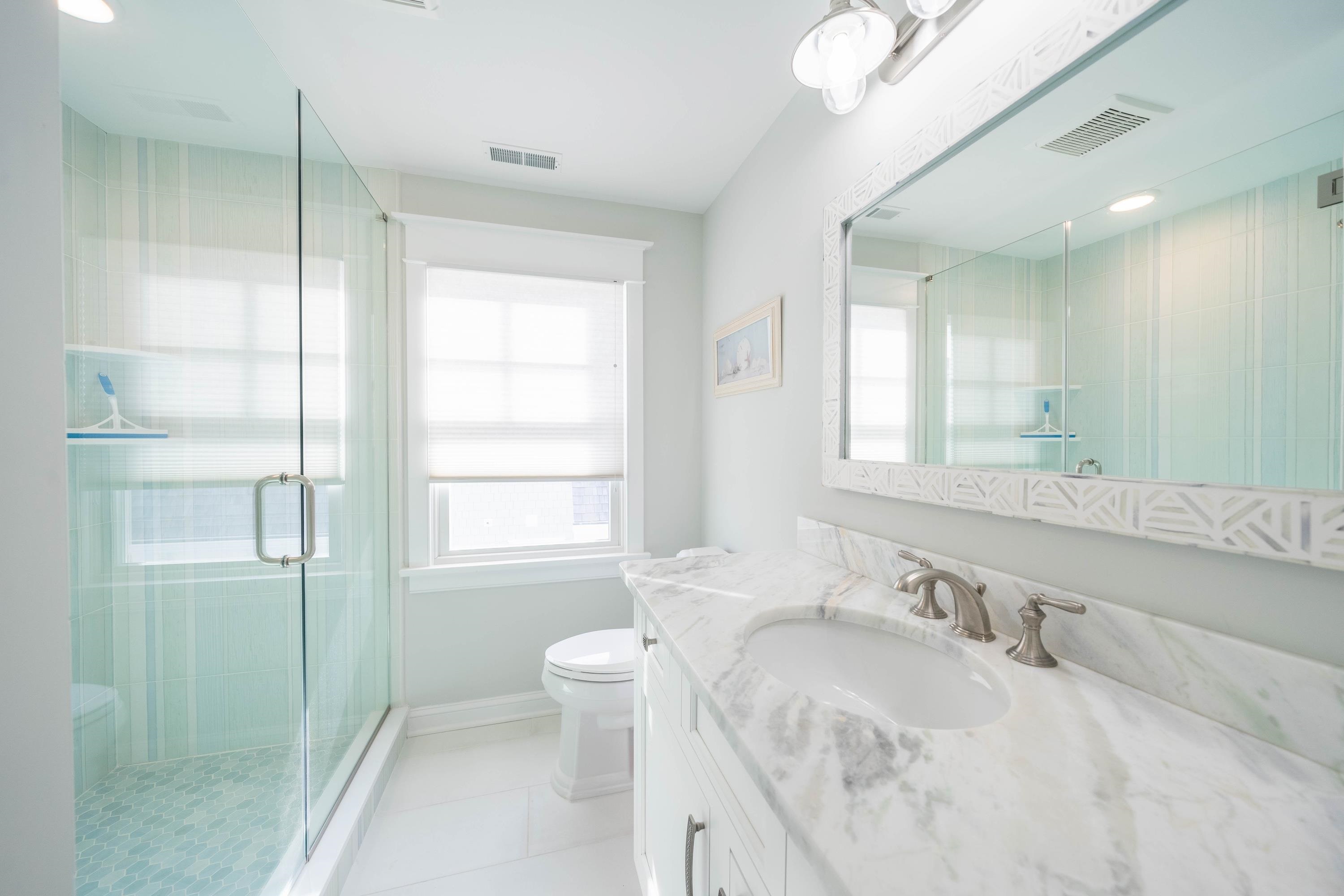 280 36th Avalon, NJ 08202 - Photo 35 of 46 a bathroom with a granite countertop sink toilet and shower