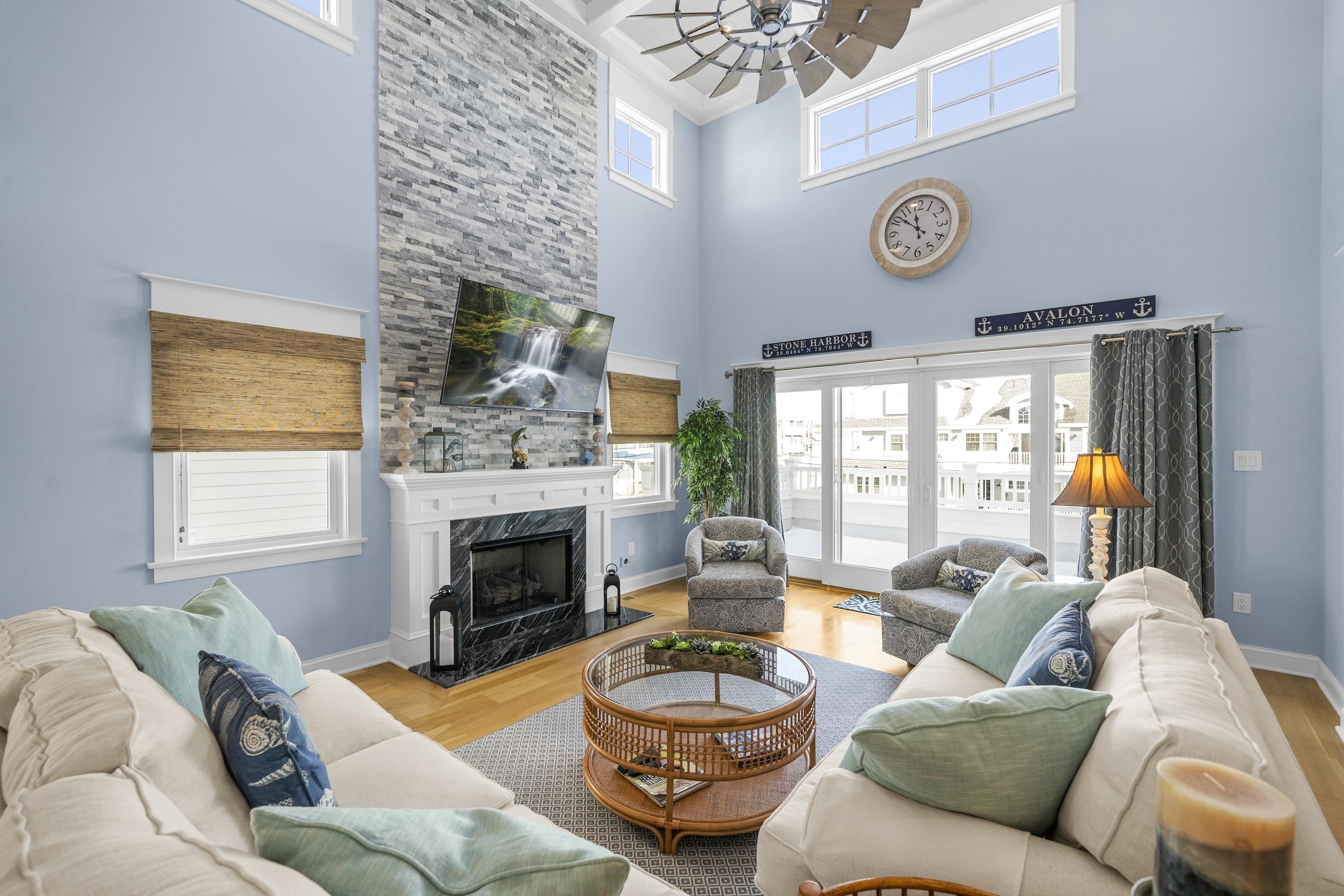 280 36th Avalon, NJ 08202 - Photo 4 of 46 a living room with furniture and a fireplace