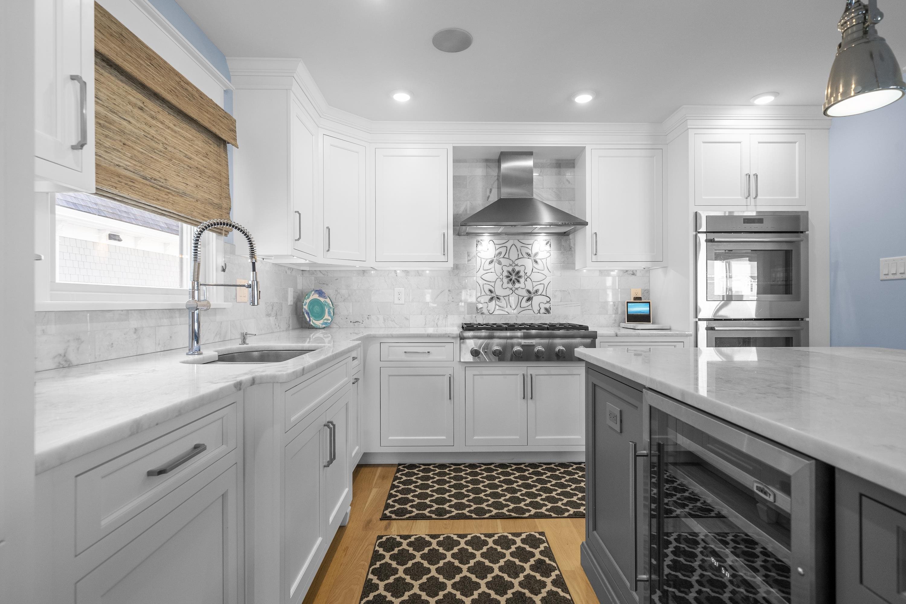 280 36th Avalon, NJ 08202 - Photo 10 of 46 a kitchen with stainless steel appliances a sink stove and cabinets