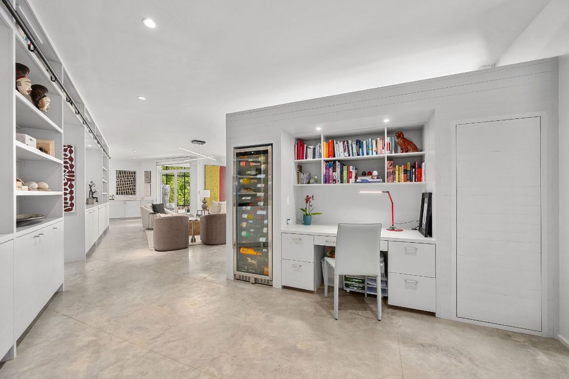3705 Bridle Path Austin, TX 78703 - Photo 11 of 26 a living room with furniture and a book shelf