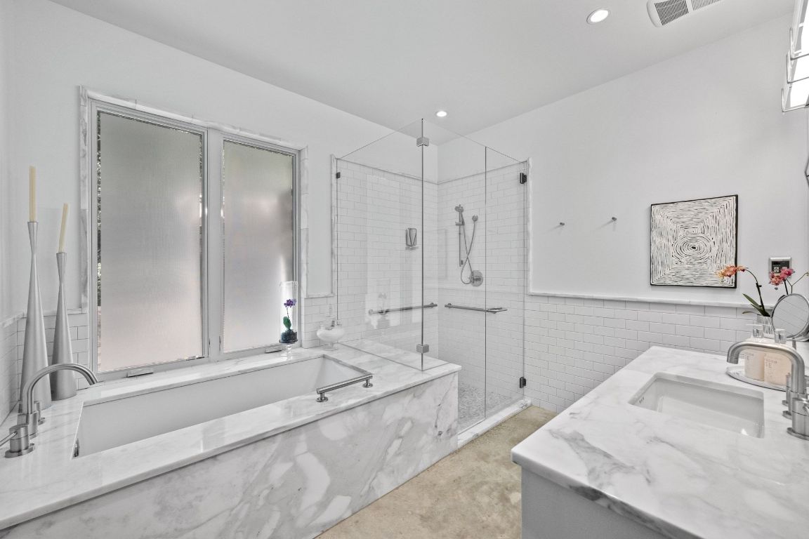 3705 Bridle Path Austin, TX 78703 - Photo 13 of 26 a spacious bathroom with a tub sink and mirror