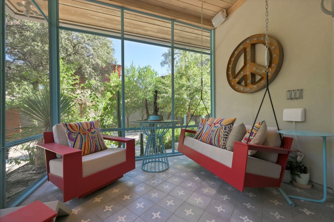 3705 Bridle Path Austin, TX 78703 - Photo 16 of 26 a living room with furniture and a large window