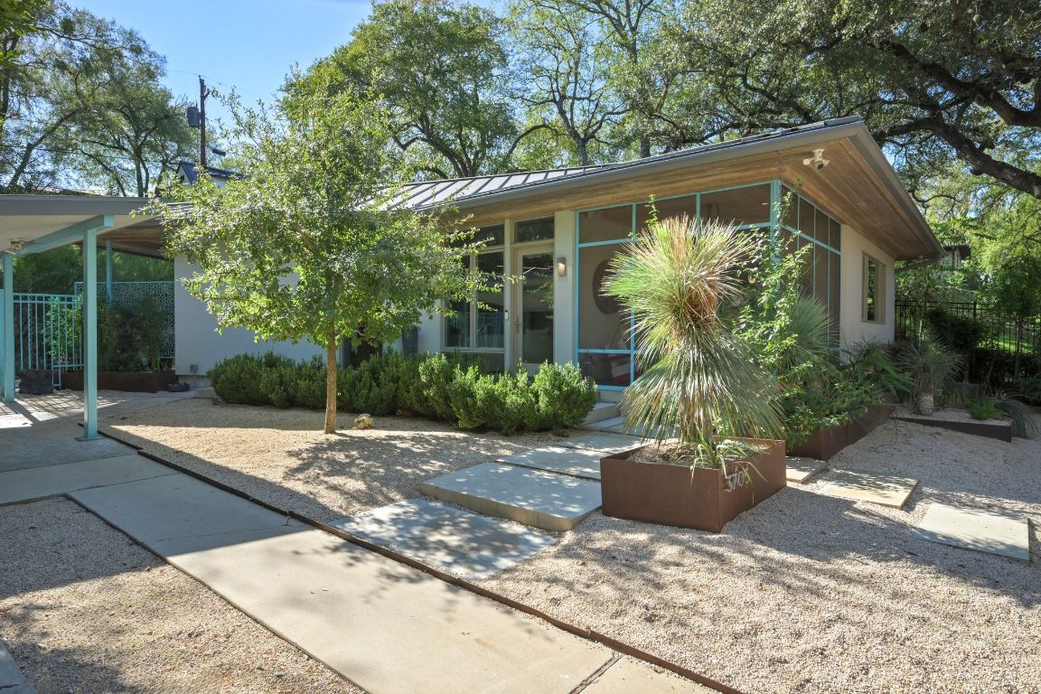 3705 Bridle Path Austin, TX 78703 - Photo 18 of 26 a front view of a house with garden
