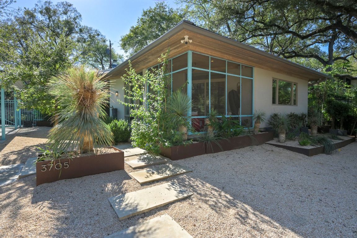 3705 Bridle Path Austin, TX 78703 - Photo 19 of 26 a front view of a house with garden