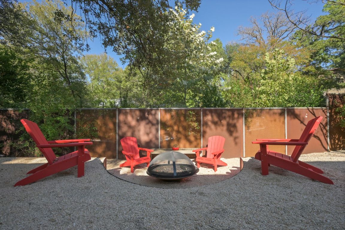 3705 Bridle Path Austin, TX 78703 - Photo 22 of 26 a backyard of a house with table and chairs