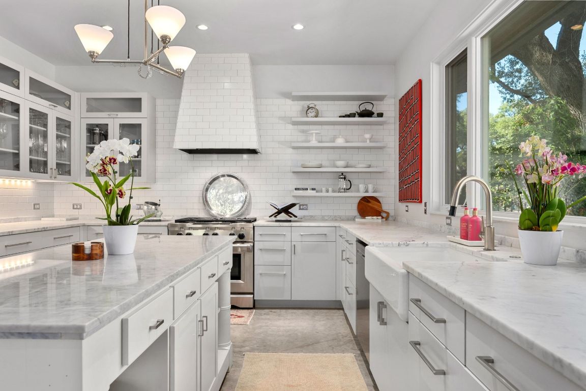3705 Bridle Path Austin, TX 78703 - Photo 5 of 26 a kitchen that has a lot of cabinets in it and wooden floor